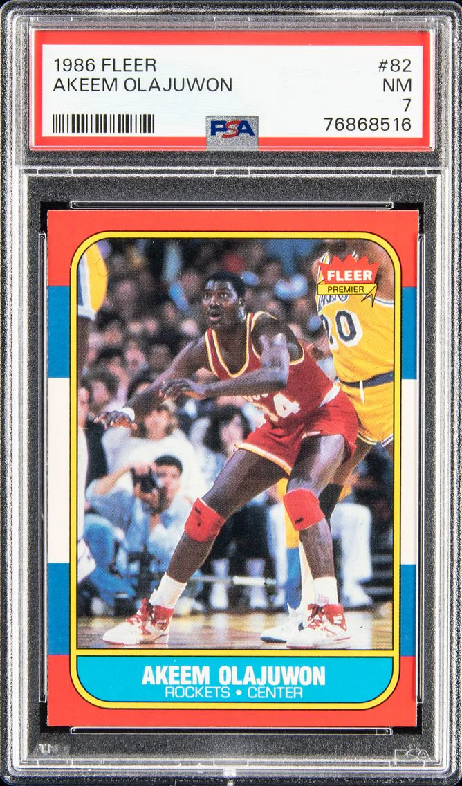 1986 #82 AKEEM OLAJUWON PSA 7 FLEER